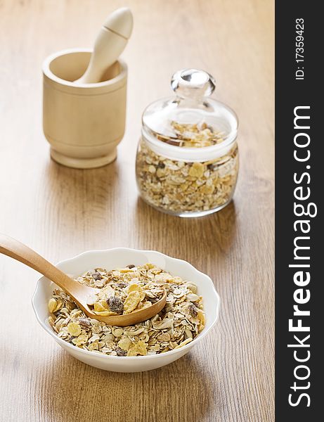 Composition of dietary food mortar and pestle on wooden background