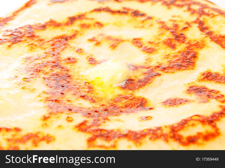 Background, fried pancake with oil. A batch.