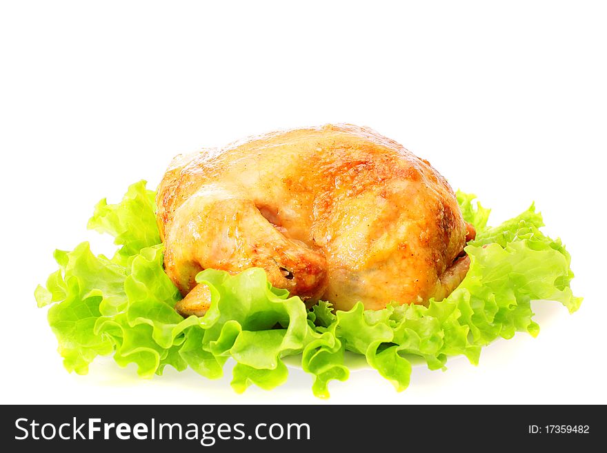 Roast chicken on leaves salad on a white background is isolated. Roast chicken on leaves salad on a white background is isolated.