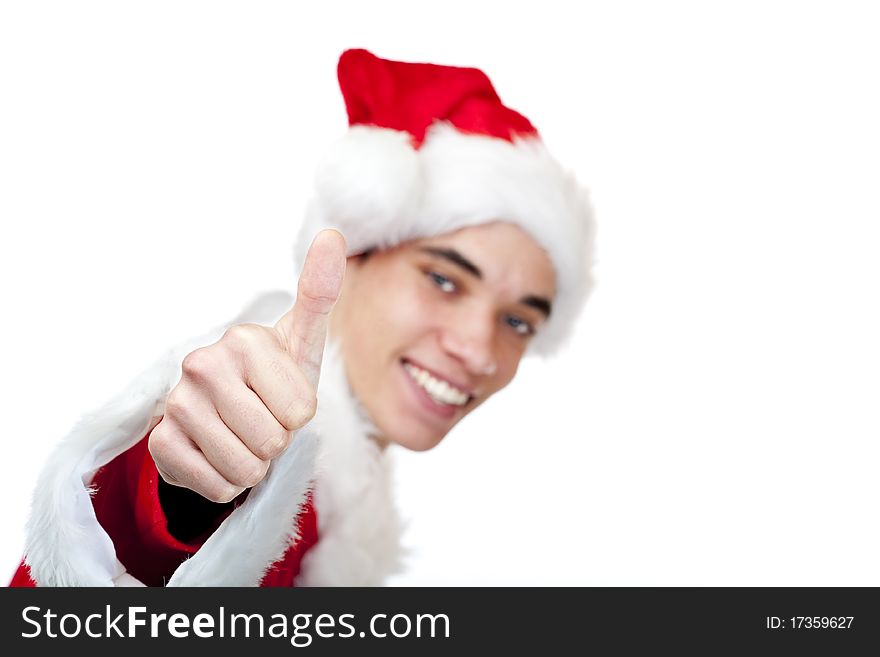 Smiling male santa claus teenager shows thumb up. Isolated on white background.