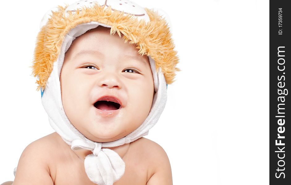 Closeup portrait of funny baby laughing with hat on his head. Closeup portrait of funny baby laughing with hat on his head