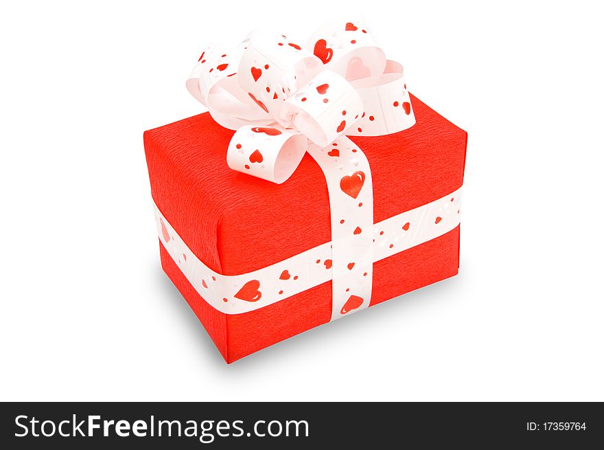 Red gift with a tape decorated with hearts. (clipping path. ). Red gift with a tape decorated with hearts. (clipping path. )