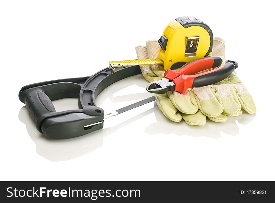 Tapeline pliers gloves on hacksaw isolated on white background