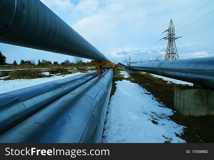 Industrial Steel pipelines smokestack blue sky
