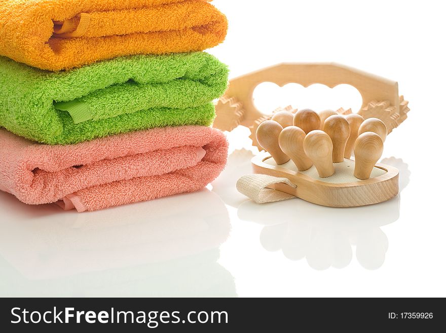 Three towels with massagers isolated on white background