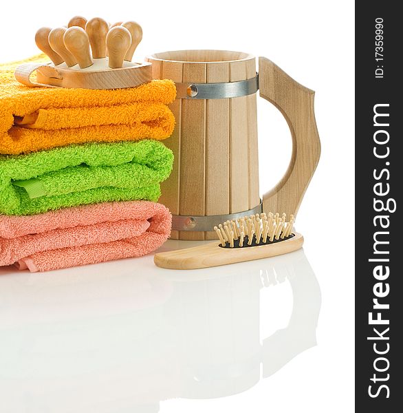 Towels with wooden objects isolated on white background