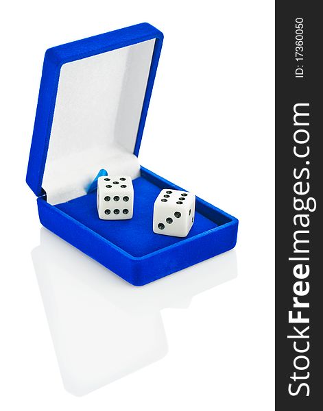 Studio shot. Two white plastic playing dice in blue box isolated. Studio shot. Two white plastic playing dice in blue box isolated