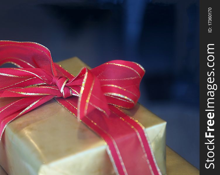 Gift box and red ribbon with copy space area