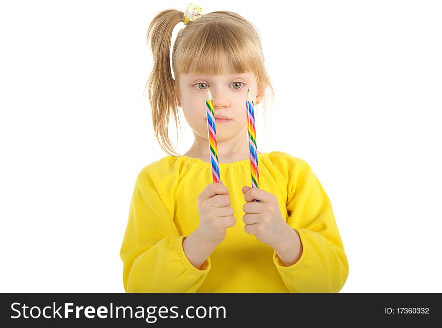 Little girl with colour pencils isolated on the white