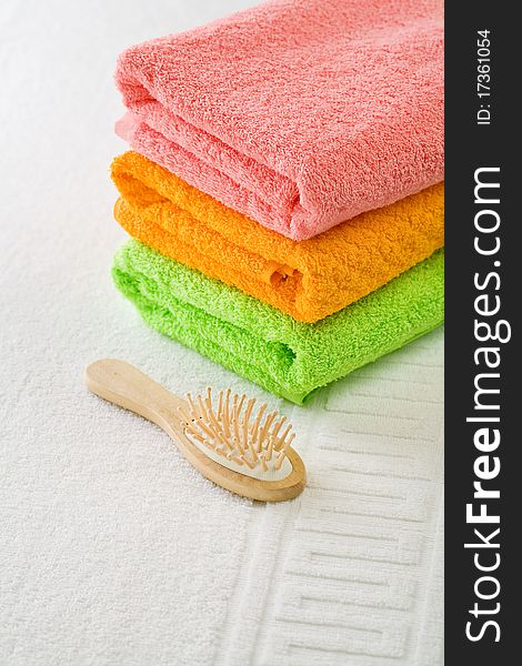 Three cotton towels with hairbrush