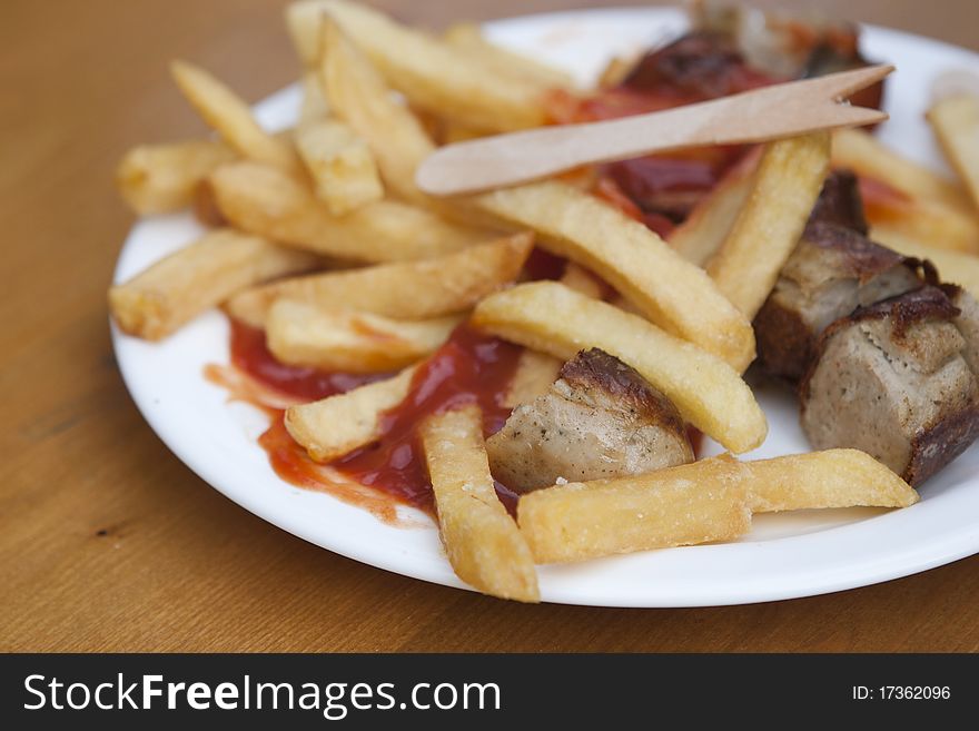 German curry wurst with french fries. German curry wurst with french fries