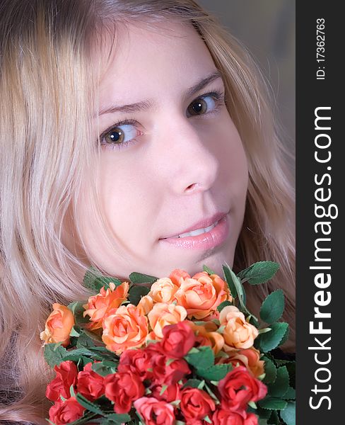 Portrait of beautiful teen smiling and holding bouquet of roses. Portrait of beautiful teen smiling and holding bouquet of roses.