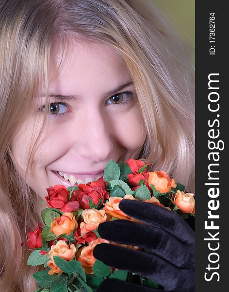 Portrait of beautiful teen smiling and holding bouquet of roses. Portrait of beautiful teen smiling and holding bouquet of roses.