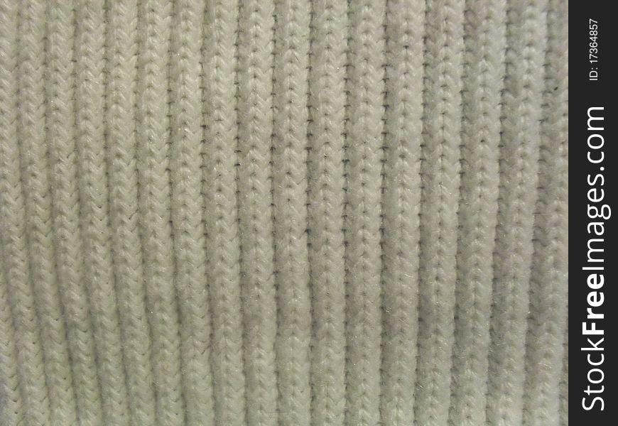 White knit pattern material background texture closeup. White knit pattern material background texture closeup