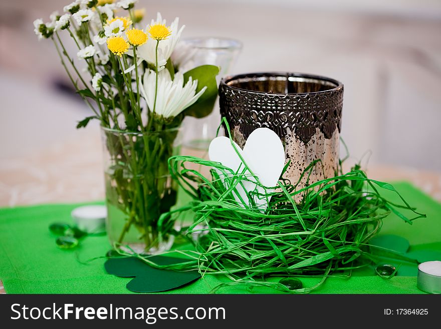 A photo of decorated wedding table and flowers