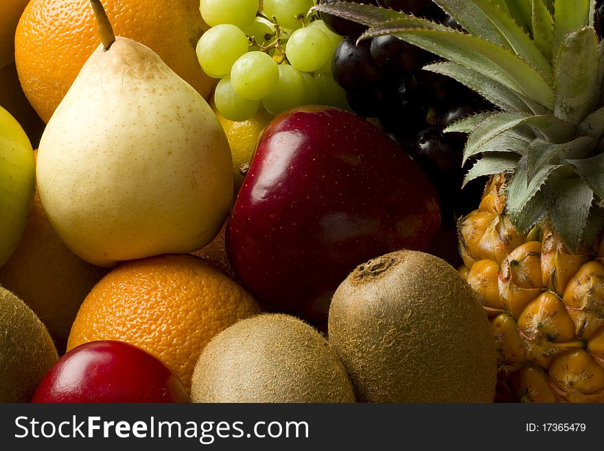 Fresh organic mixed fruit in a cardboard box. Fresh organic mixed fruit in a cardboard box