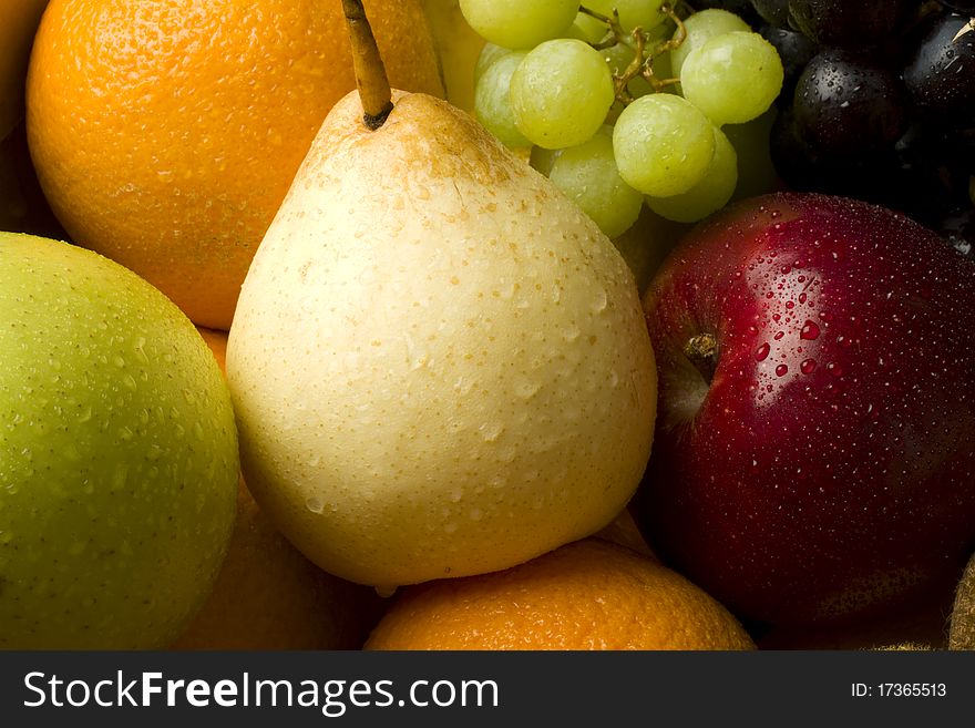 Fresh organic mixed fruit in a cardboard box. Fresh organic mixed fruit in a cardboard box