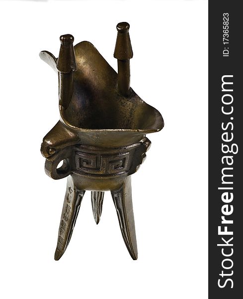 Jue - Chinese bronze ritual tripod wine vessel on white. Jue - Chinese bronze ritual tripod wine vessel on white.