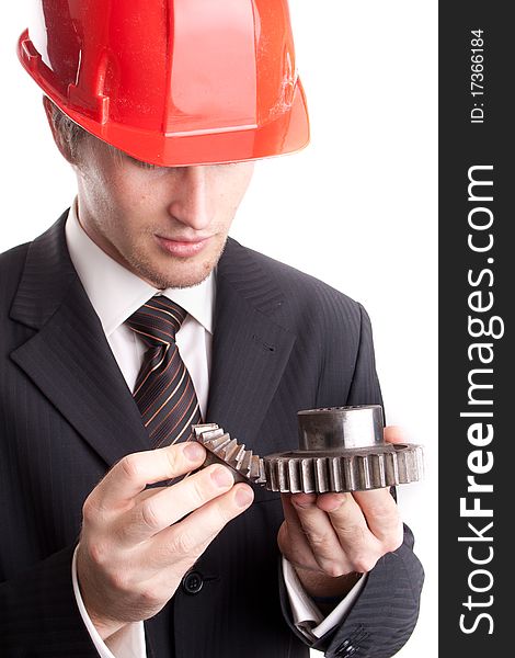 Engineer examines transmission two gear. Engineer examines transmission two gear