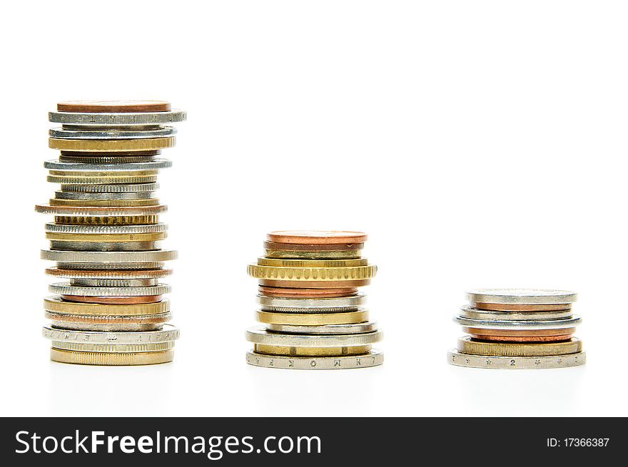 Three stacks of coins on white background