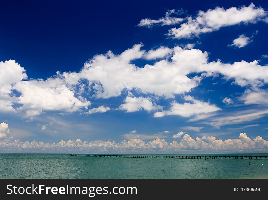 Ocean Pier Stretches Into Turquoise Sea