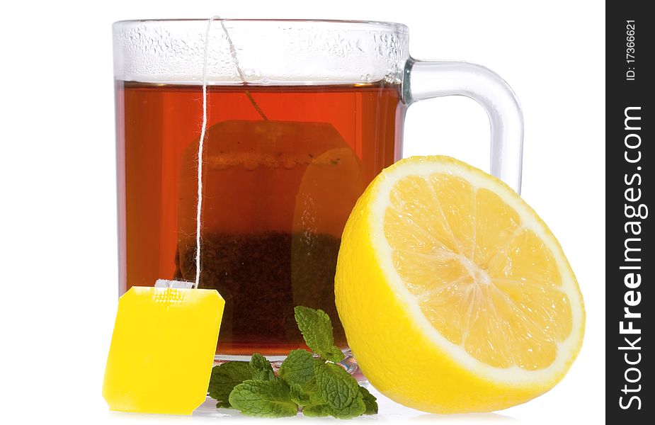 Tea with mint and lemon on white background
