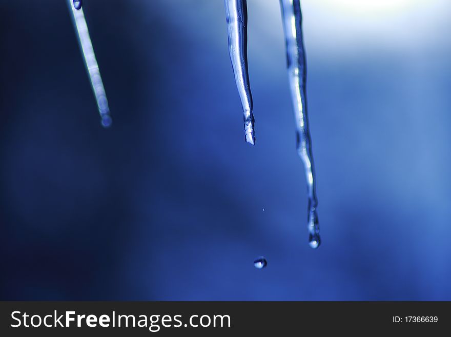 Icicle coming down from our roof. The blurred background is the sky. December 2010. Icicle coming down from our roof. The blurred background is the sky. December 2010