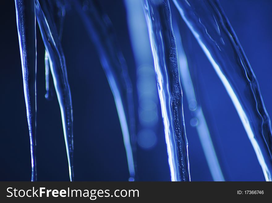 Icicle coming down from our roof. The blurred background is the sky. December 2010. Icicle coming down from our roof. The blurred background is the sky. December 2010