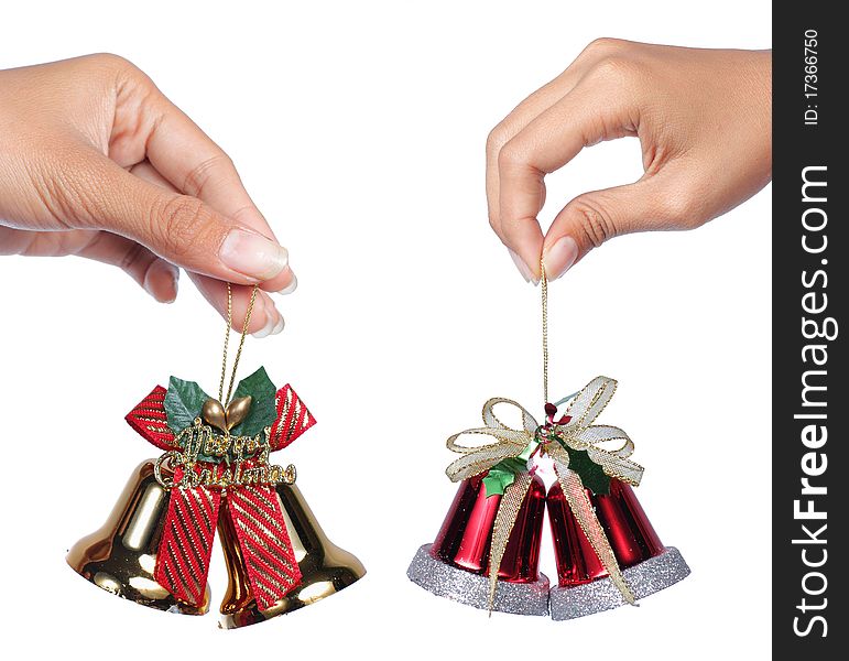 Image of two Christmas bells hold by hand. Image of two Christmas bells hold by hand
