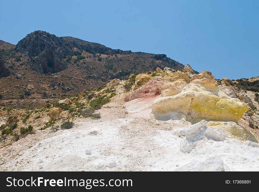 View from volcano on island of Nisyros showing coloured minerals in rock. View from volcano on island of Nisyros showing coloured minerals in rock.