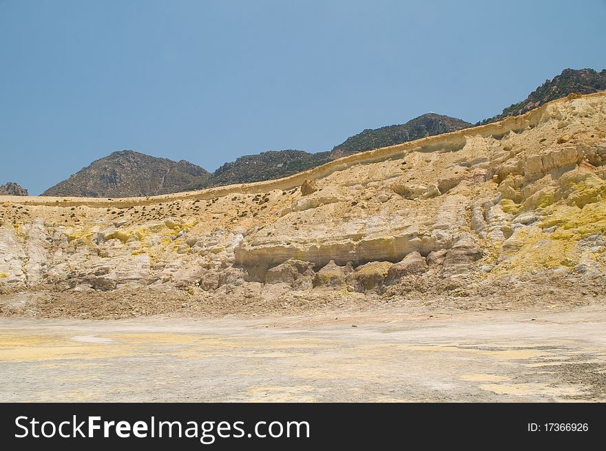 View from volcano on island of Nisyros showing coloured minerals in rock. View from volcano on island of Nisyros showing coloured minerals in rock.