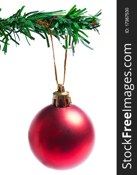 Decoration on a branch of manufactured christmas tree isolated on the white background. Decoration on a branch of manufactured christmas tree isolated on the white background