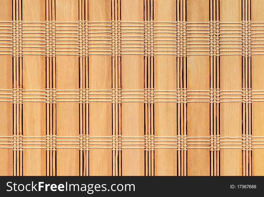 Woven bamboo mat as a simple background. Woven bamboo mat as a simple background