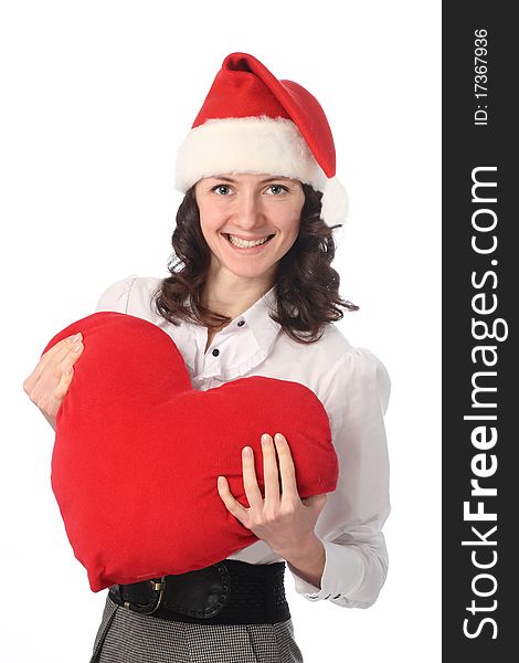 Happy young beautiful woman in Santa's hat holding red heart isolated on white. Happy young beautiful woman in Santa's hat holding red heart isolated on white