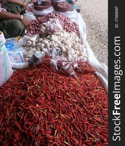 A market stall in thailand selling spices and vegetables. A market stall in thailand selling spices and vegetables