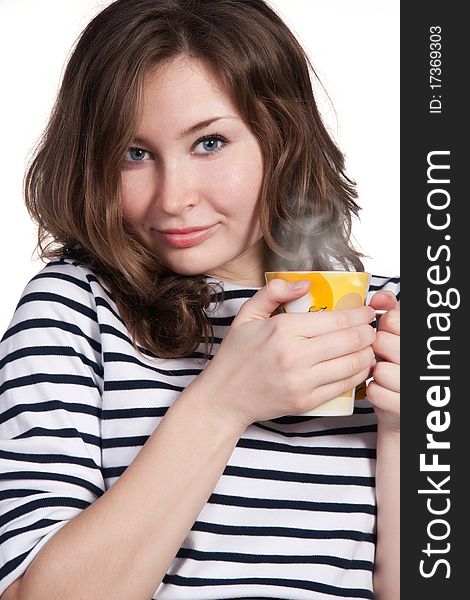 A close-up portrait of a beautiful woman holding a yellow cup of tea or coffee isolated on white background. A close-up portrait of a beautiful woman holding a yellow cup of tea or coffee isolated on white background