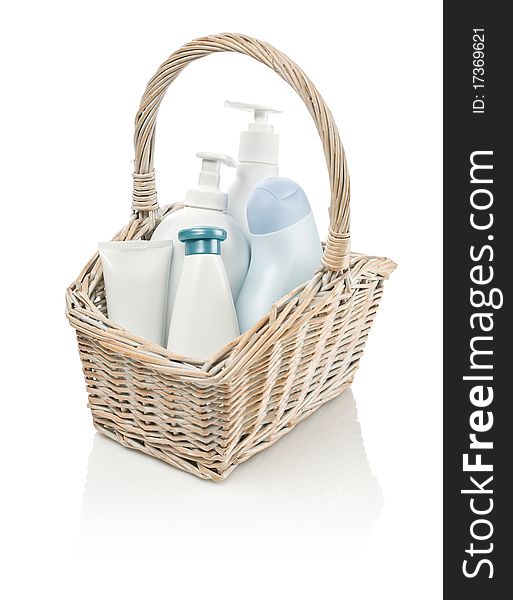 Toiletries in basket isolated on white background