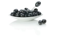 Black Olives On A Plate With Skewer Stock Photo