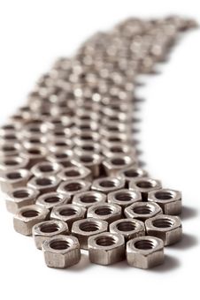 Screw Nuts Lying In A Row Royalty Free Stock Photo