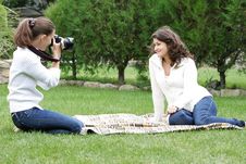 Young Women Taking Pictures On Natural Background Royalty Free Stock Photos Young Women Taking Pictures On Natural Background Royalty Free Stock Photos