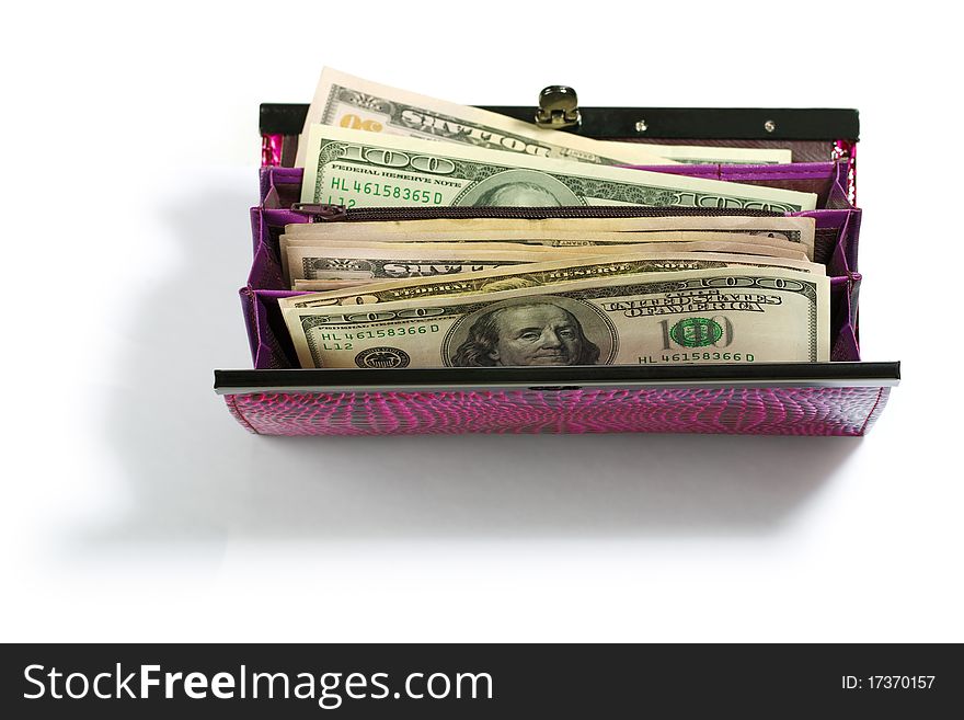 Pink classic purse with dollars isolated on white background