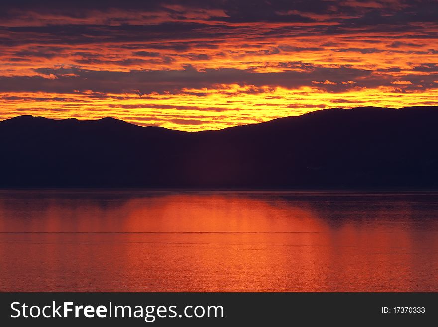 Red sunset over sea calm for wallpaper use