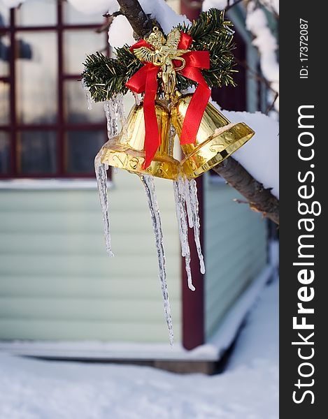 Icicles on golden christmas bells. Icicles on golden christmas bells