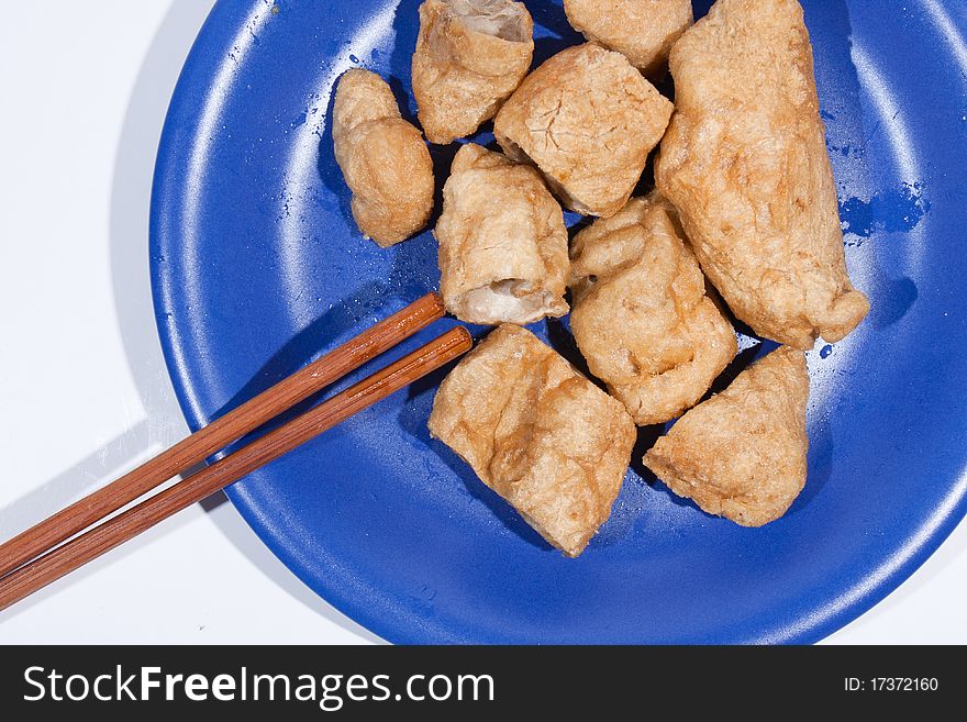 Meatball with chopsticks on a white background. Meatball with chopsticks on a white background.