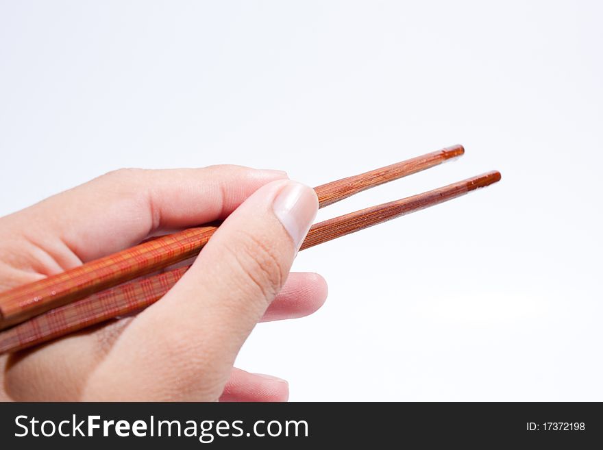 Chopsticks are the hand grip. On a white background.