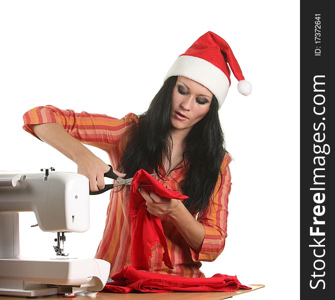 Seamstress In A Christmas Hat Cut Cloth