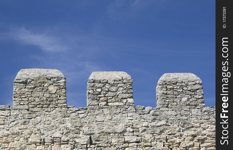 Merlons of an old fortress wall in a sunny day