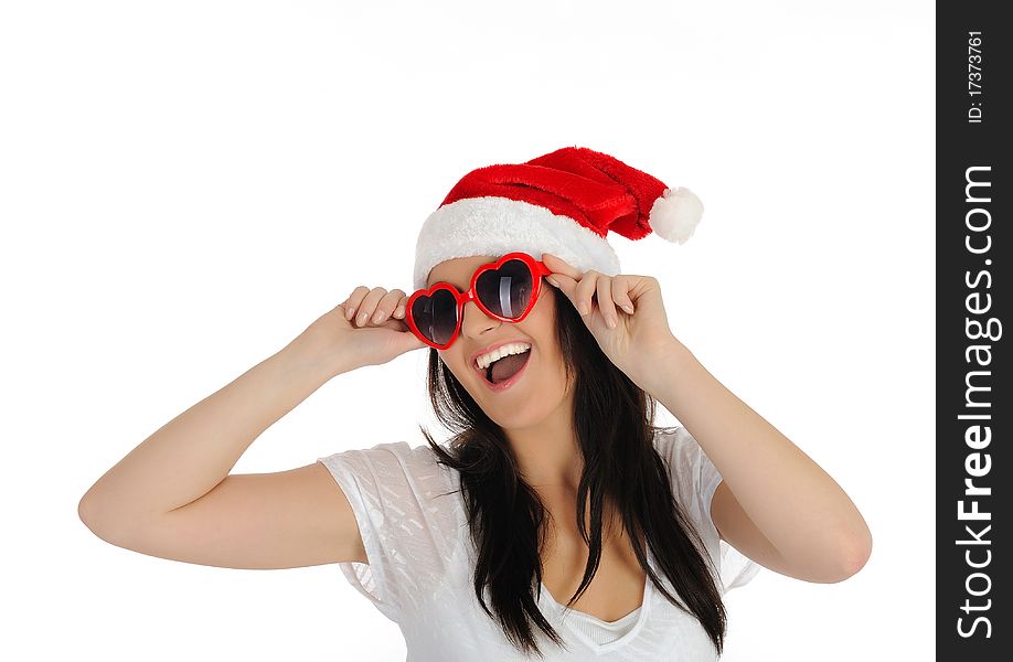 Funny sexy santa clouse woman in casual clothes, hat and red heart shaped glasses. isolated