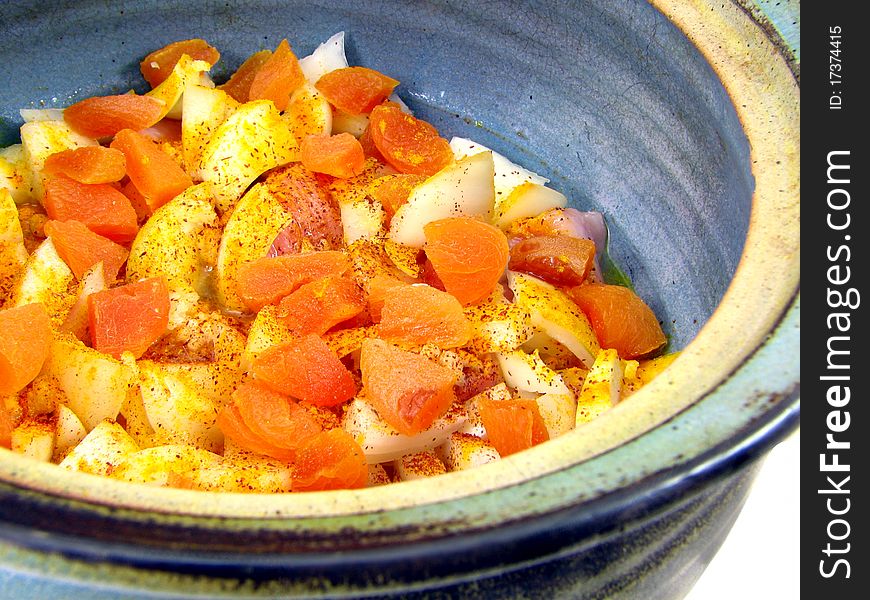 Close up photo of prepared Moroccan Chicken dish with apricots before cooking. Close up photo of prepared Moroccan Chicken dish with apricots before cooking.