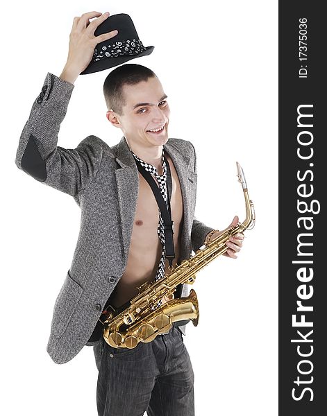 The young jazzman with saxophone takes off a hat. The young jazzman with saxophone takes off a hat